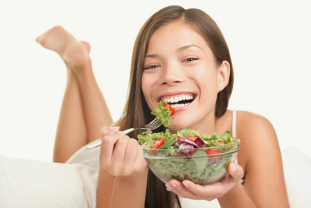 Stock photo images of women laughing with salad